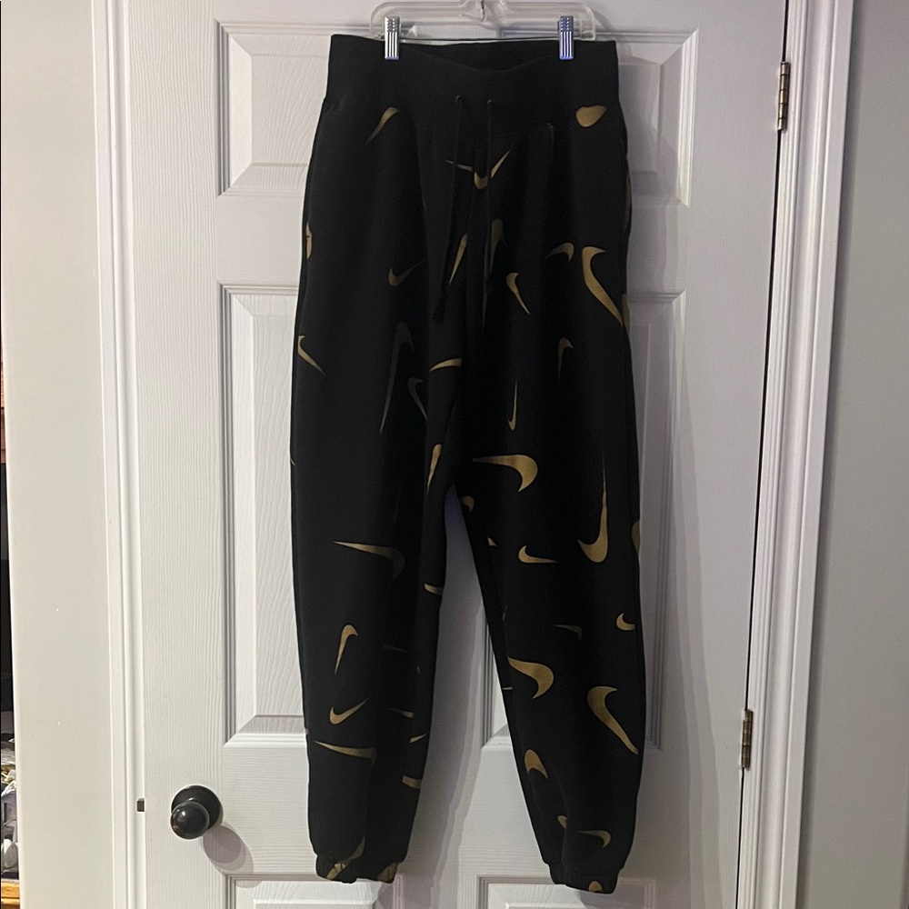 Nike Black Apparel with Gold Accent